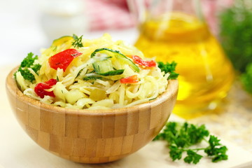 Salad with pickled cabbage, cucumbers, paprika and olive oil