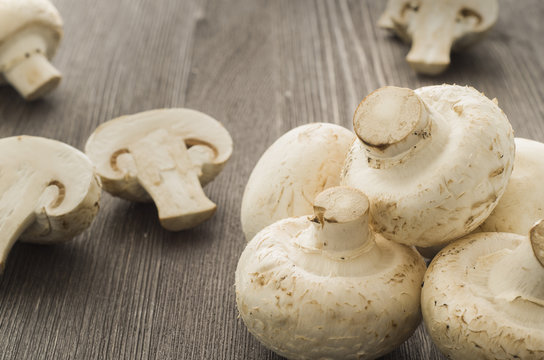 Champignons on a wooden board closeup