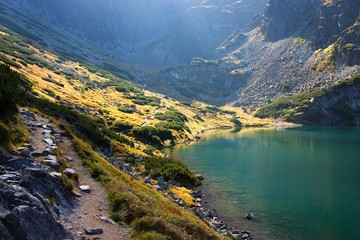 High Tatras in Poland. Lake and monumental peaks. Summer scenic landscape mountain view.