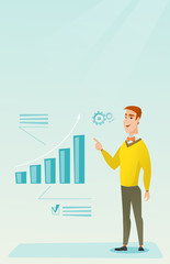 Successful businessman pointing at chart going up.