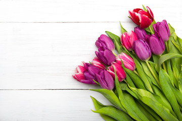 Tulip bouquet on white wooden background, copy space