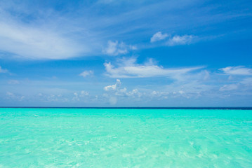 Fototapeta premium Tropical sand beach and blue sky with white clouds