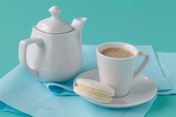 Black brewed coffee with ceramic utensils and sweets