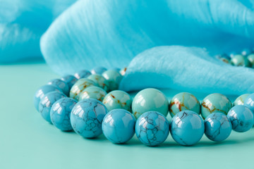 Necklace strand, blue backdrop