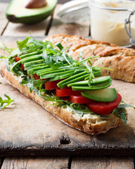 Vegan sandwich with avocado and tomatoes
