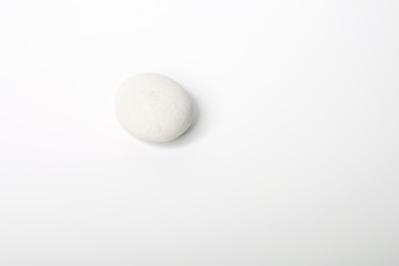 White stone of a round form are isolated on a white background