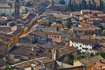 Fototapeta na wymiar View from above. Old European city, red tiled roofs, brick walls.