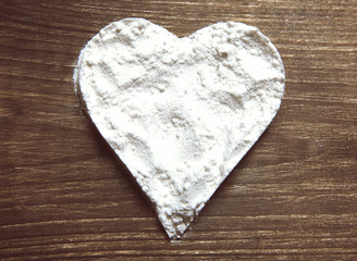 Cocaine in the form of heart, on the table
