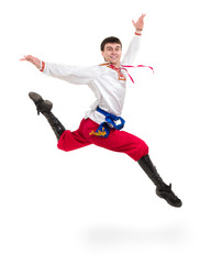 young man wearing a folk costume jumping against isolated white with copyspace