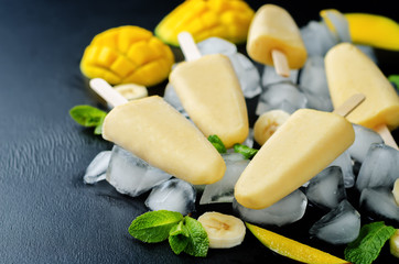 Banana mango ice cream with fruits and ices