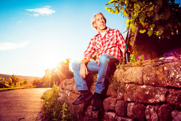 Winemaker Sitting By His Vineyard