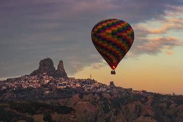 Flight of balloons over the Cappadocia, Anatolia, Turkey - the great tourist attraction.. Volcanic mountains in Goreme national park.