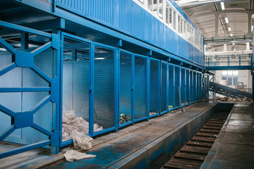 Obraz premium Waste processing plant. Technological process. Recycling and storage of waste for further disposal. Business for sorting and processing of waste.