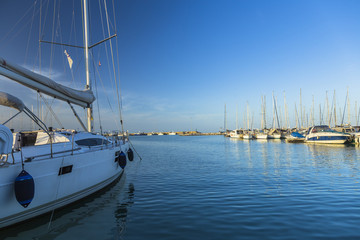 Sailing boats on a calm sea under blue sky