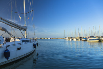 Fototapeta premium Sailing boats on a calm sea under blue sky
