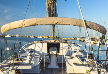 Fototapeta premium Sailing boat on a calm sea under blue sky