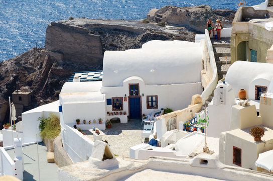 Traditional white architecture on cliffs of Santorini island, Greece