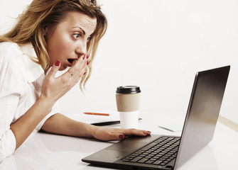 Concerned beautiful businesswoman working at a computer in the workplace