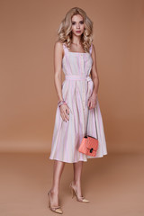 Beauty woman model wear stylish design trend clothing cotton dress casual formal office style for date walk  meeting walk party long blond hair lips makeup party businesswoman accessory bag fashion.