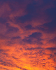 Naklejka na ściany i meble Fiery vivid sunset sky clouds