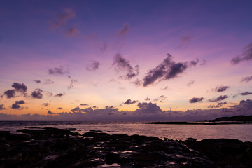 Beautiful rock patterns and sunrise at shore
