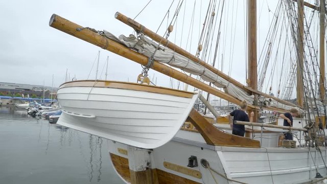 371_A_small_boat_hanging_on_the_side_of_the_big_sailboat.mov