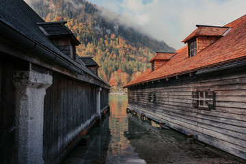 Fototapeta na wymiar Berchtesgaden, Germany. Boathouses at the Koenigssee lake for pleasure boats, which commute between Schoenau, St. Bartholomew and Salet
