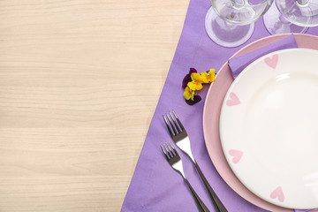 Table setting on wooden background