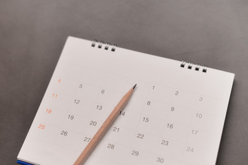 Calendar with pencil in planning concept.