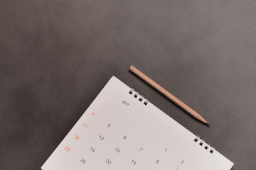 Calendar with pencil in planning concept.