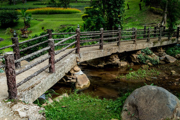 Obraz premium Concrete footbridge over the stream