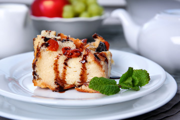 Delicious bread pudding with fruits on table