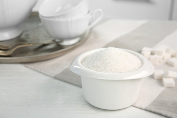 Obraz na płótnie Canvas White bowl with sugar on table