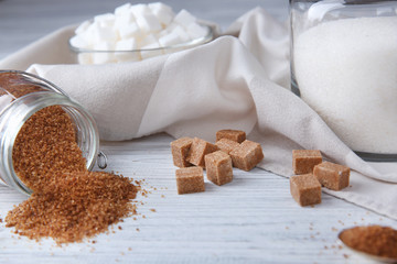 Beautiful composition with sugar on wooden table