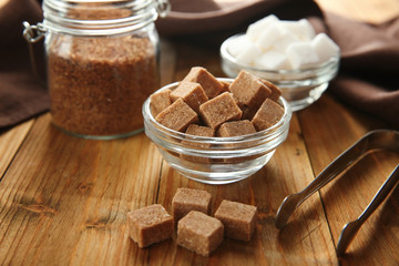 Beautiful composition with sugar on wooden background