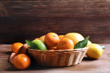 Beautiful composition of tropical fruits on wooden table