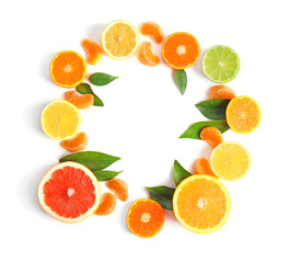 Frame of juicy citrus fruits on white background