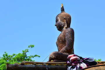 Buddha in Buddhism brought out the people to pay homage to faith. Blue sky background