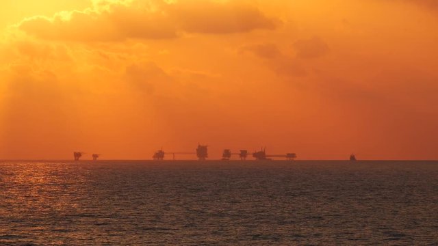 Central processing platform (cpp) in the middle of the ocean during sunset time - upstream industry
