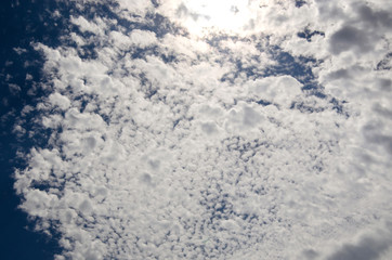 Blue sky with white cloud and partial dark clouds. Sky cloud. 