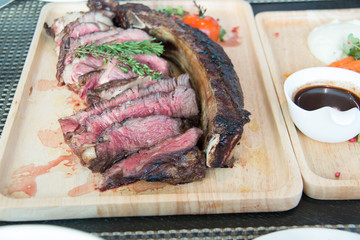  grilled tomahawk beef steak on the bone with seasonings