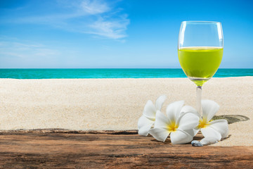 Summer drink on beach background.