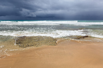 Fototapeta na wymiar Rocky beach and coming storm