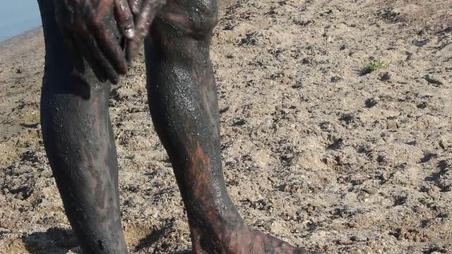Mud therapy. Mud bathing. Bath in the mud of mineral springs, used for therapeutic purposes, relieve rheumatic ailments, or beauty treatment