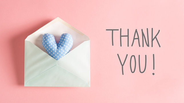 Thank You message with a blue heart cushion