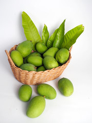 green mango in wooden box (white background)