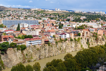 Fototapeta na wymiar View of Metekhi district on the cliff Tbilisi. Georgia
