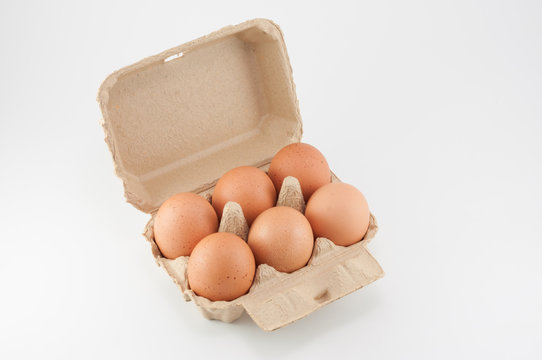 Egg box - eggs in an egg carton on white background