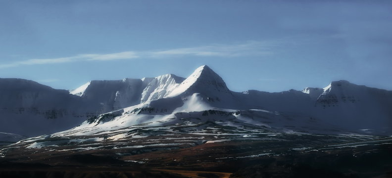 Mountains with snow in spring, east of Iceland