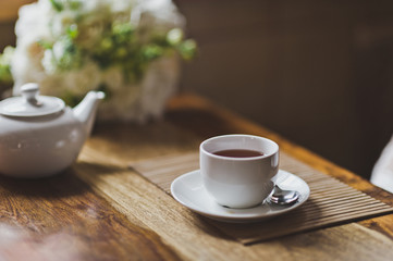 Cup for tea on a textured table 7762.